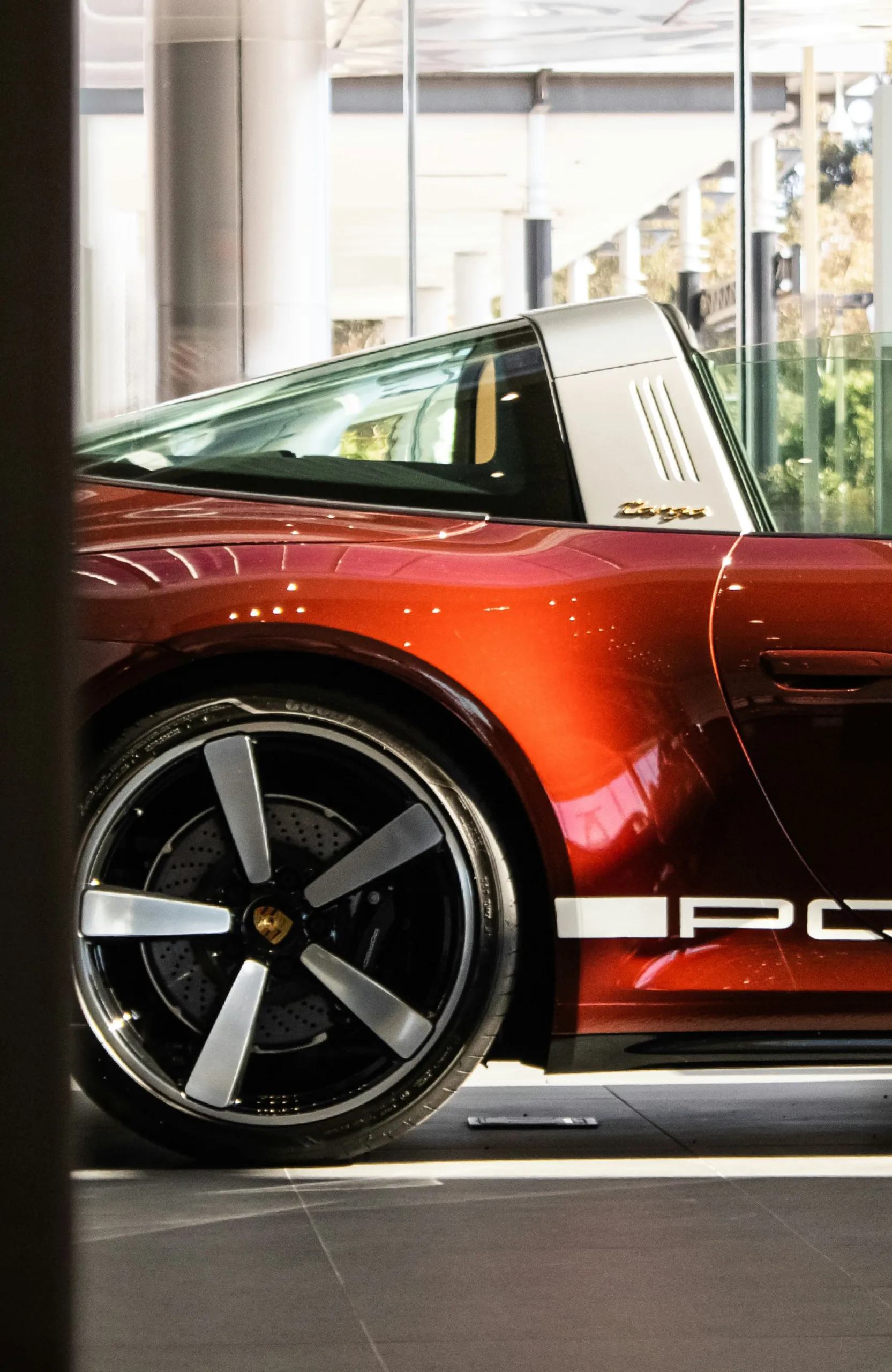 Red porsche indoors